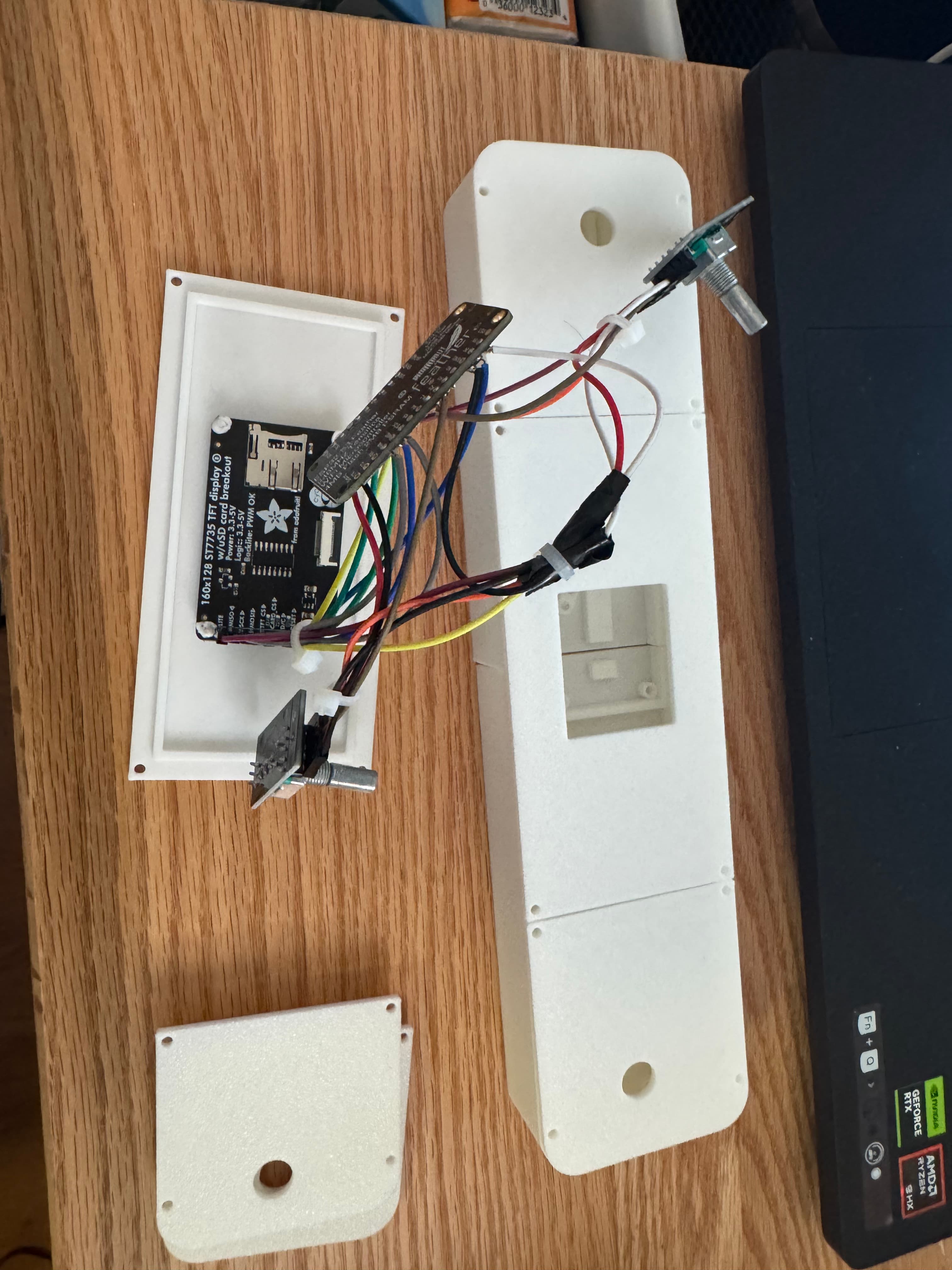 The ESP32 Feather, ST7735 display, and rotary encoder wired together as a single module